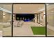 An inviting outdoor living space with a covered patio, pool access, modern seating, and seamless indoor-outdoor flow at 7278 E Echo Ln, Scottsdale, AZ 85258