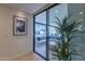 Sliding glass doors that open to an outdoor lounge area with a pool at 7278 E Echo Ln, Scottsdale, AZ 85258