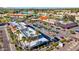 Overhead view of a shopping center and homes near a canal, set against a scenic mountain backdrop at 7312 N Via Camello Del Norte St # 95, Scottsdale, AZ 85258
