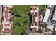 Overhead view of residential buildings, landscaped areas, and trees, with red tiled roofs and well-maintained lawns at 7312 N Via Camello Del Norte St # 95, Scottsdale, AZ 85258