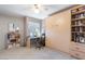 Bedroom featuring a built-in Murphy bed, closet, shelving, and desk with a window at 7312 N Via Camello Del Norte St # 95, Scottsdale, AZ 85258