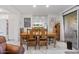 Elegant dining room featuring a large wooden table, seating for eight, and natural light, ideal for Gathering gatherings at 7312 N Via Camello Del Norte St # 95, Scottsdale, AZ 85258