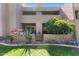 Well-maintained exterior featuring mature trees, lush lawn, and vibrant landscaping for a charming curb appeal at 7312 N Via Camello Del Norte St # 95, Scottsdale, AZ 85258