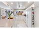 Modern white kitchen featuring tile floors, updated appliances, and ample counter space with a view from the sink at 7312 N Via Camello Del Norte St # 95, Scottsdale, AZ 85258