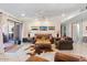 Inviting living room with a ceiling fan, tile floors, and sliding doors to the patio at 7312 N Via Camello Del Norte St # 95, Scottsdale, AZ 85258