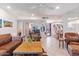 Bright living room features tile floors, comfortable seating, and easy access to the outdoors at 7312 N Via Camello Del Norte St # 95, Scottsdale, AZ 85258