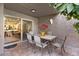 Covered patio with dining table, seating, and an outdoor rug, creating a perfect space for outdoor dining and relaxation at 7312 N Via Camello Del Norte St # 95, Scottsdale, AZ 85258