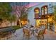 Beautiful back patio with comfortable seating, a modern fire pit, and manicured landscaping at 8001 N 3Rd Pl, Phoenix, AZ 85020