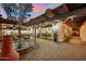 Relaxing backyard with a fountain, outdoor kitchen, pergola, and direct access to the home's modern kitchen at 8001 N 3Rd Pl, Phoenix, AZ 85020
