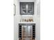 Stylish bar area featuring a wine fridge, ample storage, and sleek countertops for entertaining at 8001 N 3Rd Pl, Phoenix, AZ 85020