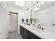 Bright bathroom with double sinks, ample counter space, and modern black and white accents at 8001 N 3Rd Pl, Phoenix, AZ 85020