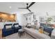 Comfortable living room showcasing stylish furnishings, a ceiling fan, hardwood floors, and an open layout at 8001 N 3Rd Pl, Phoenix, AZ 85020