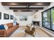 Cozy living room showcasing a fireplace, comfortable seating, and a serene outdoor view for relaxation at 8001 N 3Rd Pl, Phoenix, AZ 85020