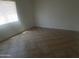 This bedroom is bright with lots of sunlight and tile floors at 8141 W Elm St, Phoenix, AZ 85033