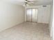 Bright bedroom with mirror closet and tile floors at 8141 W Elm St, Phoenix, AZ 85033