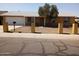 Charming single-story home featuring a well-manicured front yard and an attached garage at 8141 W Elm St, Phoenix, AZ 85033