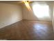 Bright living room features neutral tile floors and a ceiling fan for added comfort at 8141 W Elm St, Phoenix, AZ 85033