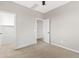 This bedroom offers neutral walls, carpet flooring, ceiling fan and a walk-in closet at 9743 E Torino Ave, Mesa, AZ 85212