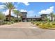 Beautiful clubhouse featuring modern architecture, desert landscaping and ample parking at 9743 E Torino Ave, Mesa, AZ 85212