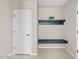 Mud room features a storage shelf and a bench with hooks at 9743 E Torino Ave, Mesa, AZ 85212