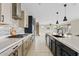 A spacious modern kitchen with stainless steel appliances, light countertops and tile backsplash at 9743 E Torino Ave, Mesa, AZ 85212
