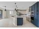 This kitchen features stainless steel appliances, pendant lighting, and a large island with bar seating at 9743 E Torino Ave, Mesa, AZ 85212