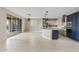 Spacious living area with an open floor plan, connecting the kitchen, dining, and outdoor spaces at 9743 E Torino Ave, Mesa, AZ 85212