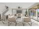 Bright living room featuring neutral decor, large windows, and seamless access to the outdoors at 9743 E Torino Ave, Mesa, AZ 85212
