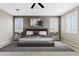 Serene main bedroom with ample natural light, plush carpeting, and elegant window shutters at 9743 E Torino Ave, Mesa, AZ 85212