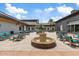 Inviting courtyard with a fountain, seating areas, and shade umbrellas for relaxing at 9743 E Torino Ave, Mesa, AZ 85212