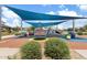 Colorful community playground with shade structure, play equipment, and inviting landscaping at 9743 E Torino Ave, Mesa, AZ 85212