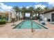 Community splash pool complete with shade structures, lounge seating, and an ADA chairlift at 9743 E Torino Ave, Mesa, AZ 85212