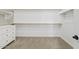 Walk-in closet offers white shelving and closet rods and carpet flooring at 9743 E Torino Ave, Mesa, AZ 85212