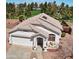 Aerial view of home showcasing its roof, landscaping, and proximity to green space at 10928 W Kaler Dr, Glendale, AZ 85307