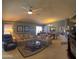 Inviting living room with cozy seating and view into the dining area at 10928 W Kaler Dr, Glendale, AZ 85307