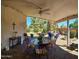 Inviting covered patio with a ceiling fan and views of the manicured backyard at 10928 W Kaler Dr, Glendale, AZ 85307