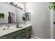 Well-lit bathroom with double sinks, vanity, and a large mirror, offering a clean and functional space at 1225 N 36Th St # 2101, Phoenix, AZ 85008