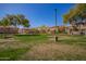 Exterior shot showcases lush green spaces with mature trees, offering residents a tranquil outdoor environment at 1225 N 36Th St # 2101, Phoenix, AZ 85008