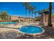 Resort-style hot tub and a refreshing pool area, lined with lounge chairs and mature palms at 1225 N 36Th St # 2101, Phoenix, AZ 85008