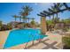 Enjoy the community swimming pool surrounded by towering palm trees, perfect for outdoor relaxation and leisure at 1225 N 36Th St # 2101, Phoenix, AZ 85008