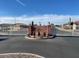 Gated community entrance with desert landscaping and cacti at 1306 N Lantana N Pl, Casa Grande, AZ 85122