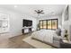 Serene main bedroom showcasing a sliding glass door, contemporary furnishings, and seamless access to the ensuite bathroom at 13930 E Barwick Dr, Scottsdale, AZ 85262