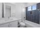 Bathroom featuring tiled shower with tub, modern toilet and sink at 14328 E Peak View Rd, Scottsdale, AZ 85262