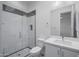 Bathroom featuring tiled shower with glass door, modern toilet and sink at 14328 E Peak View Rd, Scottsdale, AZ 85262