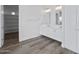 Bright bathroom featuring a double sink vanity with wooden floors and an open walk-in closet at 14328 E Peak View Rd, Scottsdale, AZ 85262