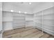 Spacious closet with wooden floors, recessed lighting, and shelving storage at 14328 E Peak View Rd, Scottsdale, AZ 85262