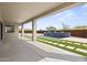 Covered patio with tile flooring, artificial turf, and water feature provides an oasis for outdoor living at 14328 E Peak View Rd, Scottsdale, AZ 85262