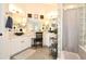 Bright bathroom featuring dual sinks, vanity, and glass block wall at 1450 N Sailors Way, Gilbert, AZ 85234