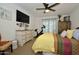 Comfortable bedroom featuring a cozy bed, a ceiling fan, and ample natural light, creating a relaxing atmosphere at 1450 N Sailors Way, Gilbert, AZ 85234