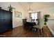 Elegant dining room featuring a stylish table set, modern lighting, and ample space for Gathering gatherings at 1450 N Sailors Way, Gilbert, AZ 85234